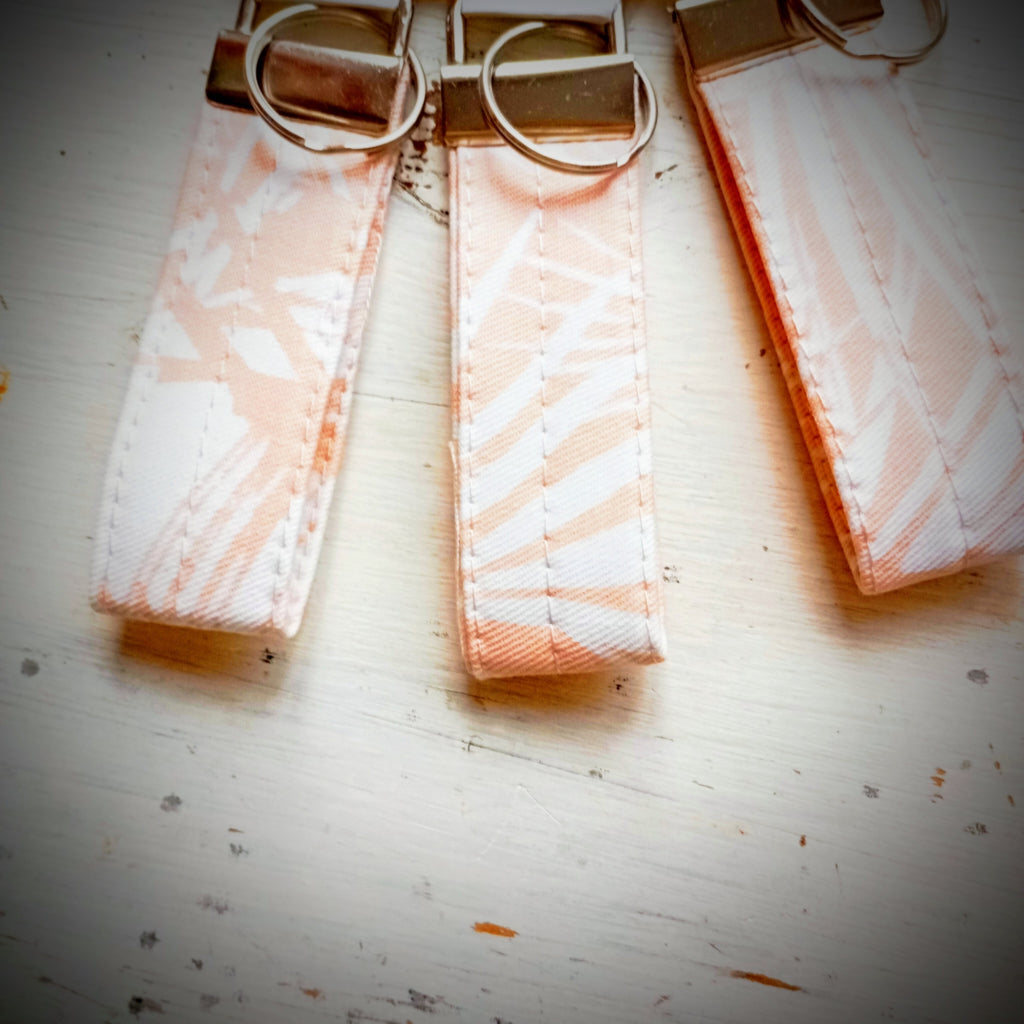 Schlüsselband Apricot-Weiß Palmblätter Baumwolle